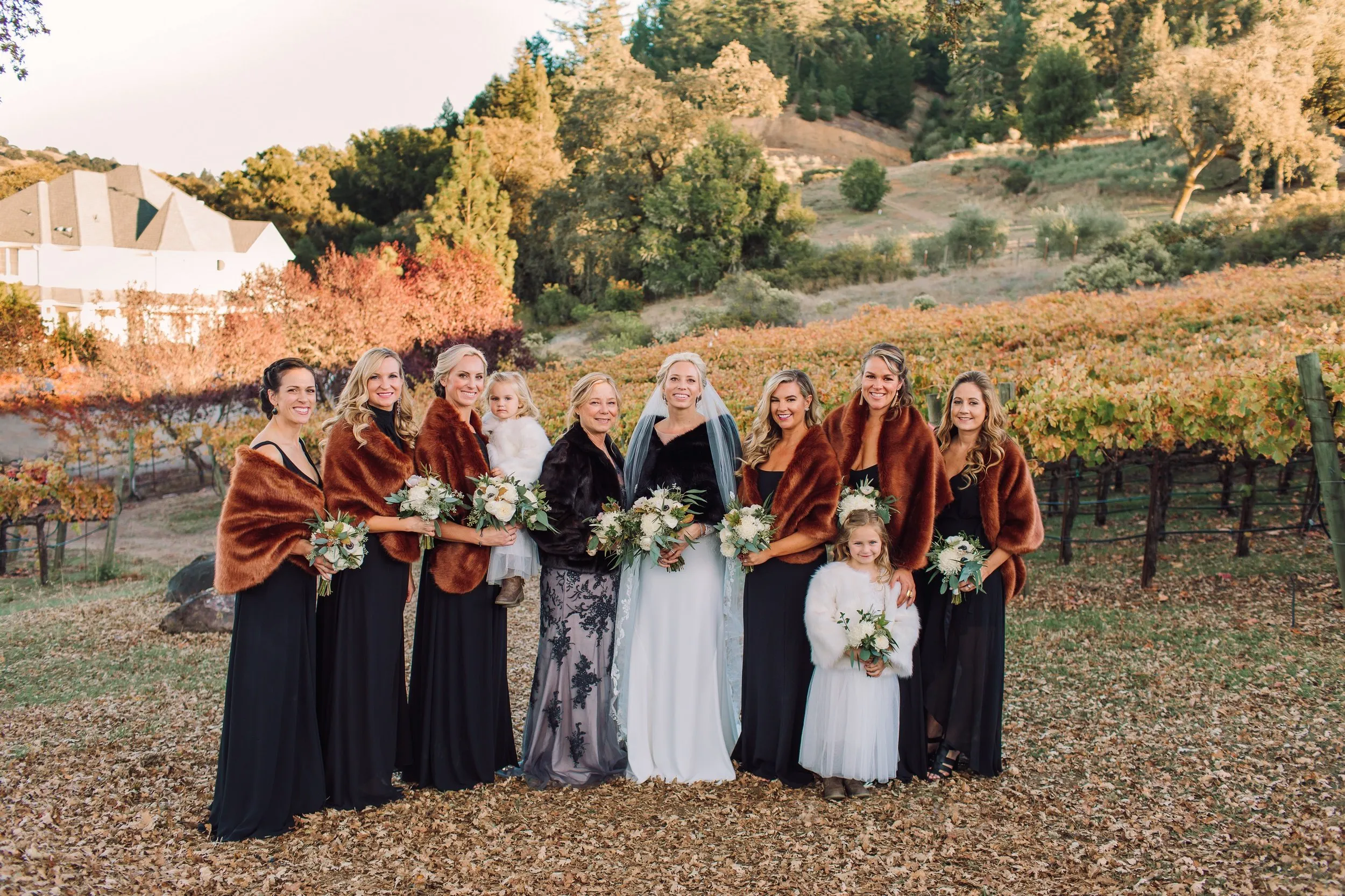 Bridal party with fall color in vineyard